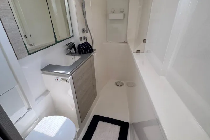 Slide: The Image of Modern bathroom interior on a 2020 Leopard 50 yacht, featuring sleek fixtures and minimalist design. - 21