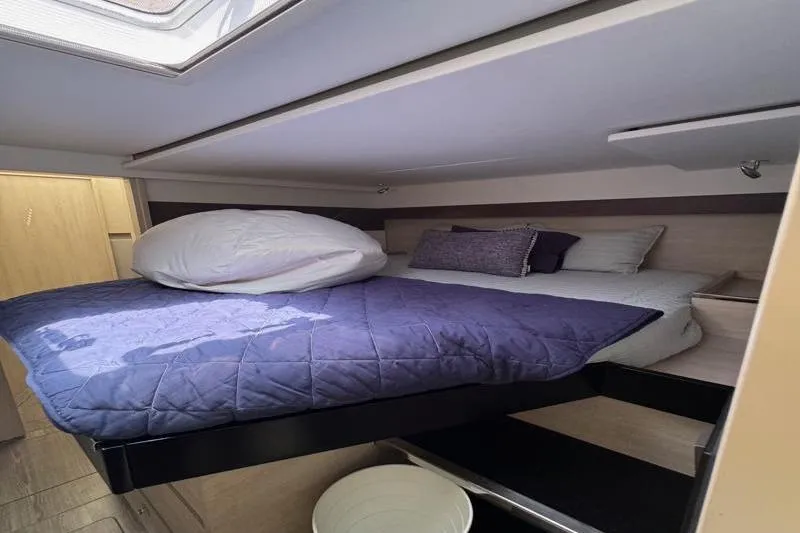 Slide: The Image of Cozy cabin bedroom in 2020 Leopard 50 yacht with skylight and plush bedding. - 23