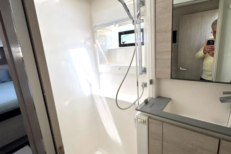 Slide: The Image of Modern bathroom interior in a 2020 Leopard 50 yacht, featuring sleek fixtures and ample lighting. - 25