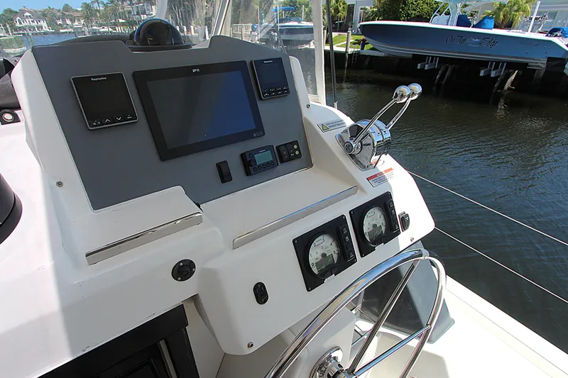 Slide: The Image of Helm of 2020 Leopard 50 yacht with navigation controls and steering wheel. - 33