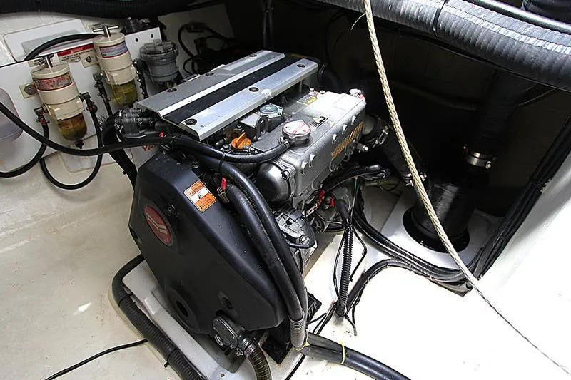 Slide: The Image of Engine compartment of a 2020 Leopard 50 yacht, showcasing mechanical components and wiring. - 36