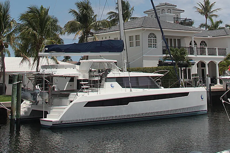 Slide: The Image of Luxury Leopard 50 catamaran docked by waterfront mansion, 2020 model. - 44
