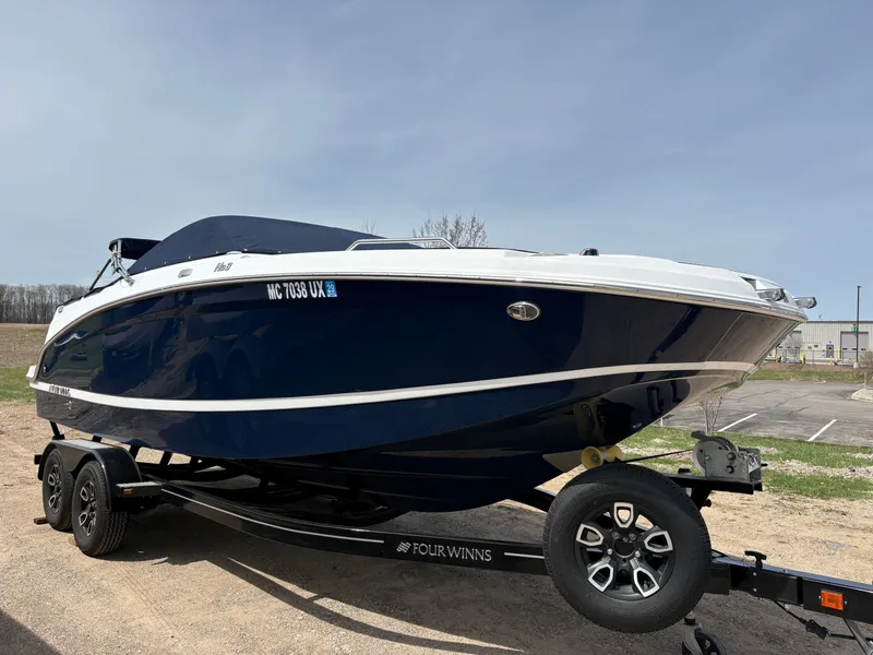 The Image of 2023 Four Winns HD3 boat on trailer outdoors. - 0