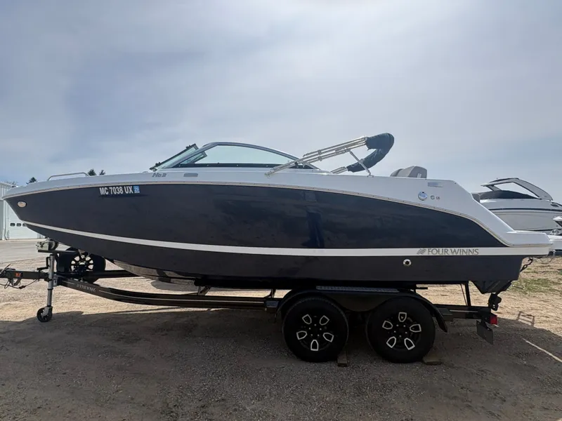The Image of 2023 Four Winns HD3 boat on trailer, side view. - 1