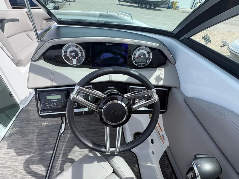 Slide: The Image of Interior view of 2023 Four Winns HD3 boat cockpit. - 10