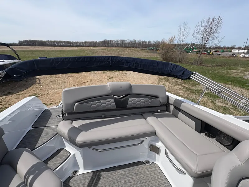 Slide: The Image of Interior of a 2023 Four Winns HD3 boat with gray seating. - 12