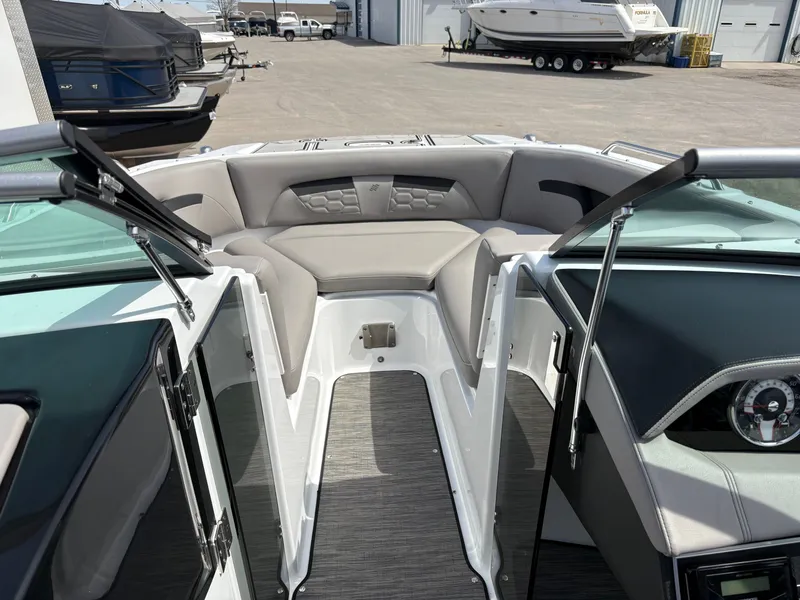 Slide: The Image of Interior of a 2023 Four Winns HD3 boat with gray seating. - 13