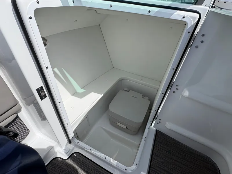 Slide: The Image of Interior of 2023 Four Winns HD3 with portable toilet. - 17