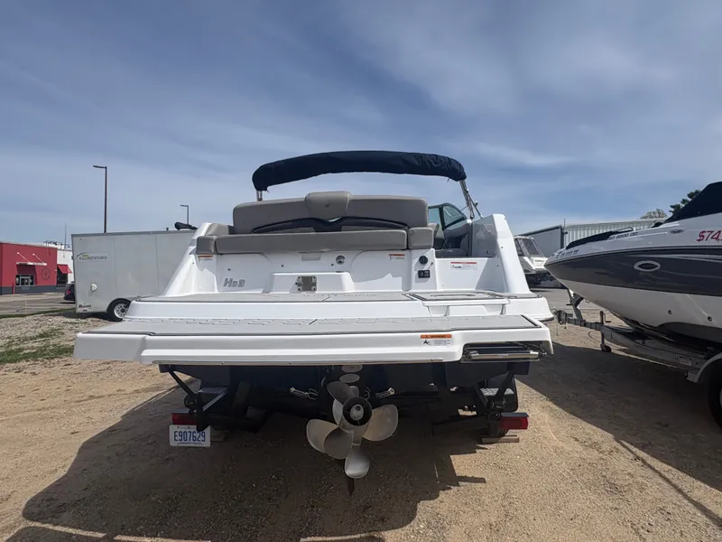 Slide: The Image of Rear view of a 2023 Four Winns HD3 boat on a trailer. - 3