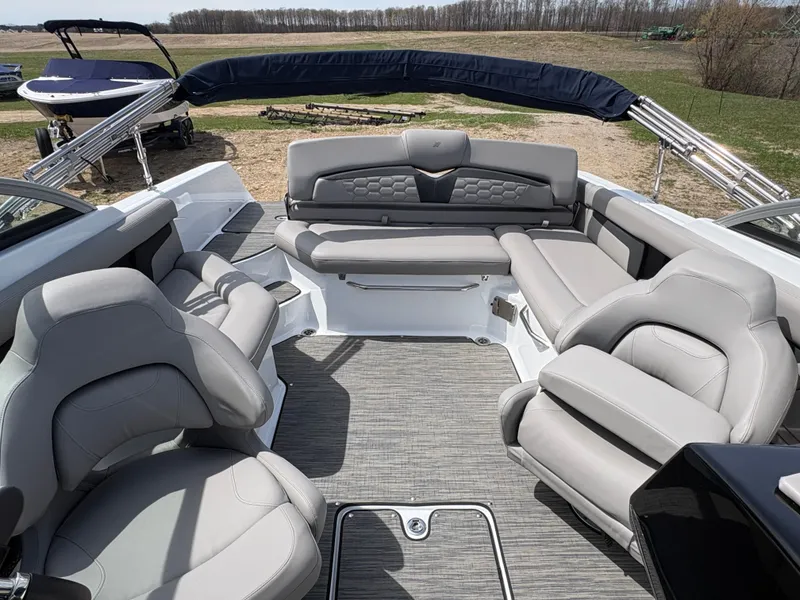 Slide: The Image of Interior of 2023 Four Winns HD3 boat with gray leather seating. - 6