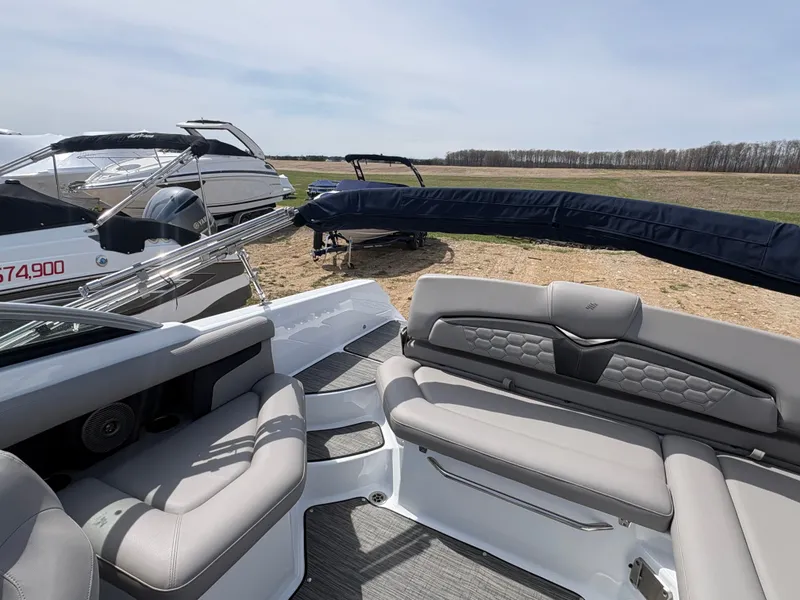 Slide: The Image of Interior of a 2023 Four Winns HD3 boat with gray seating. - 7