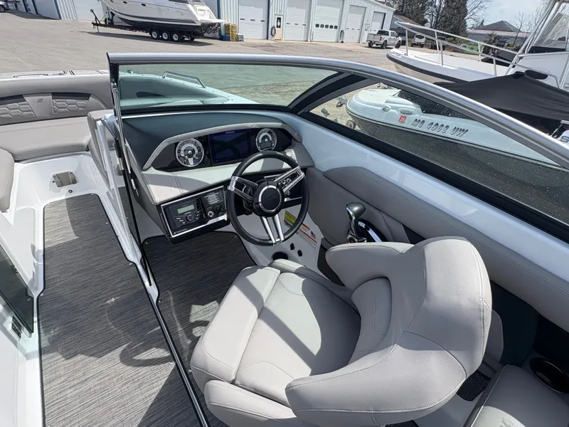 Slide: The Image of Interior of a 2023 Four Winns HD3 boat with modern cockpit. - 8