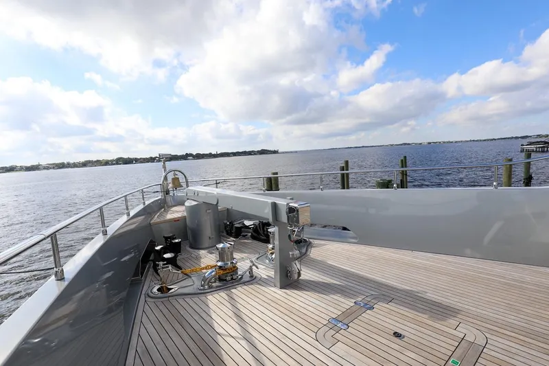 Slide: The Image of Majesty 120 yacht deck, 2025 model, overlooking serene waters and blue sky. - 18