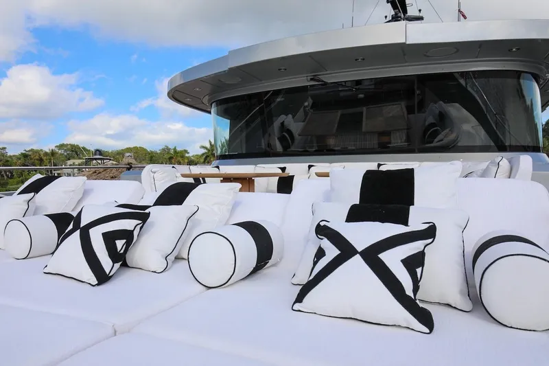 Slide: The Image of Luxurious 2025 Majesty 120 yacht with stylish black and white cushions on deck. - 23
