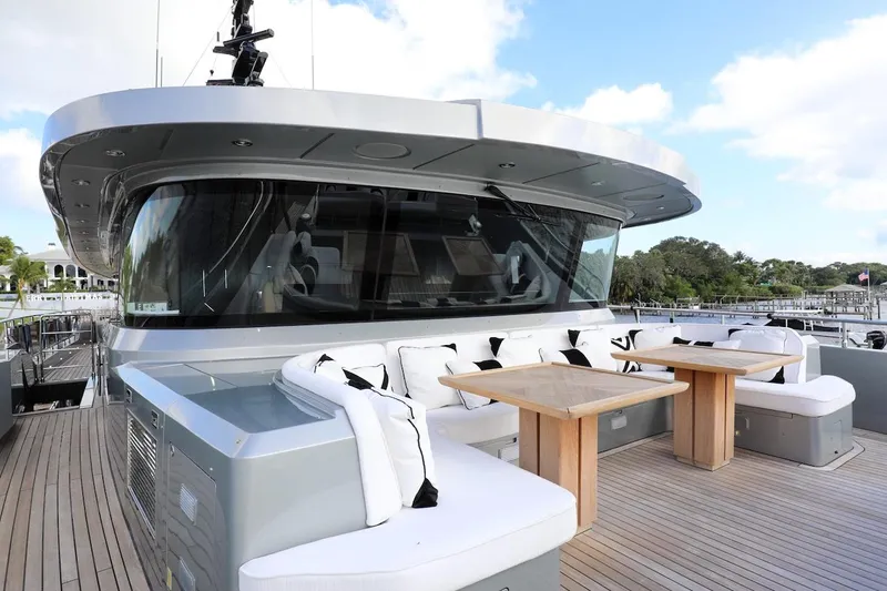 Slide: The Image of Luxury Majesty 120 yacht deck with seating and tables, 2025 model. - 25