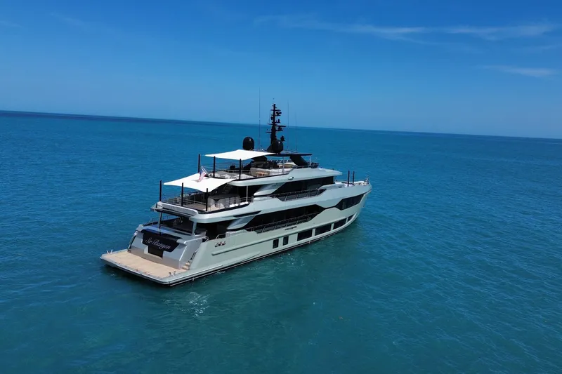 Slide: The Image of Luxurious 2025 Majesty 120 yacht cruising on clear blue ocean waters. - 3