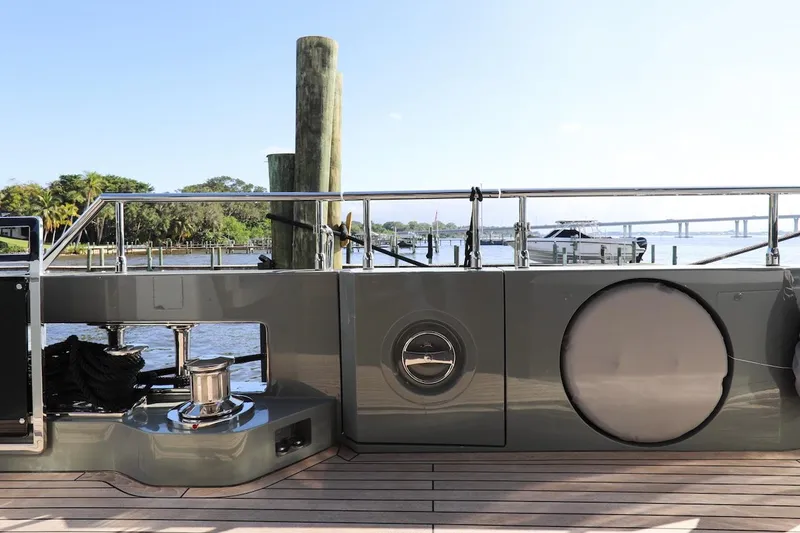 Slide: The Image of Majesty 120 yacht deck, 2025 model, docked with scenic waterfront view. - 32