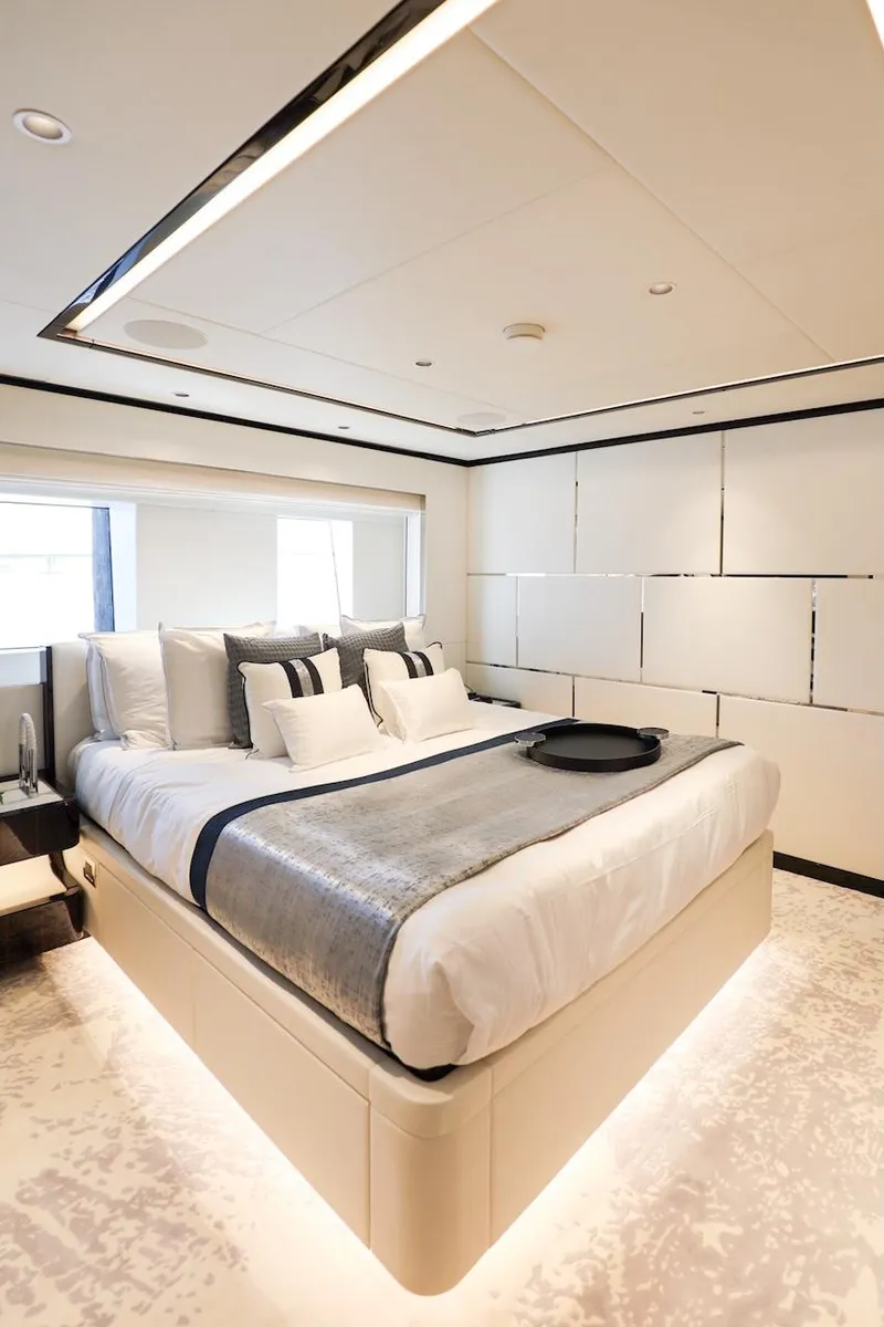Slide: The Image of Luxurious bedroom interior in 2025 Majesty 120 yacht, featuring modern design and elegant decor. - 52