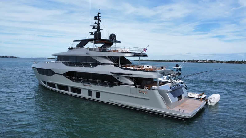 Slide: The Image of Luxury 2025 Majesty 120 yacht cruising on open water under a clear sky. - 9