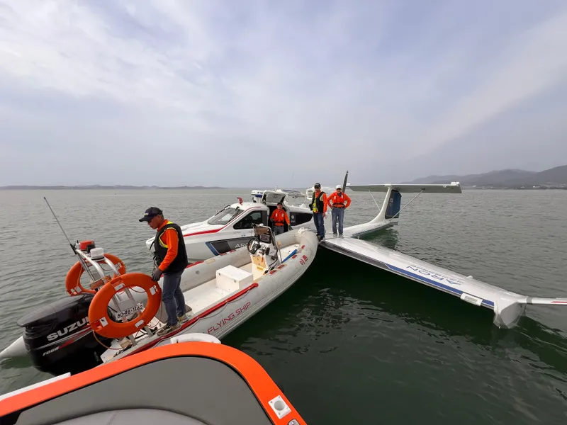 Slide: The Image of Rescue team near Aron M 80 seaplane on water, 2025 model. - 26