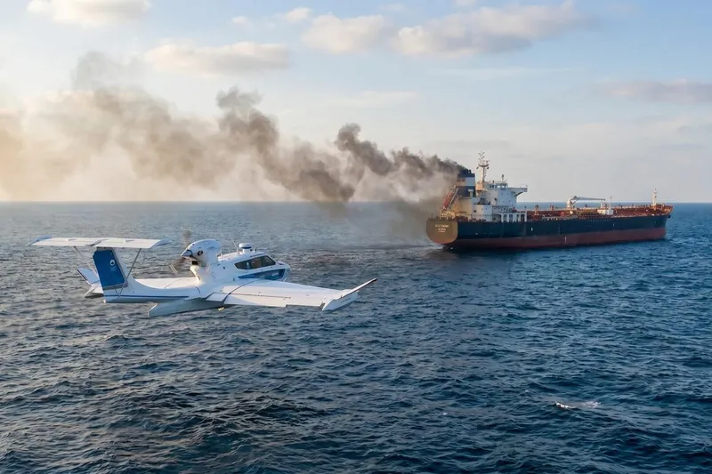 Slide: The Image of Seaplane flying near a smoking cargo ship on the ocean, Aron M 80, 2026 model. - 4