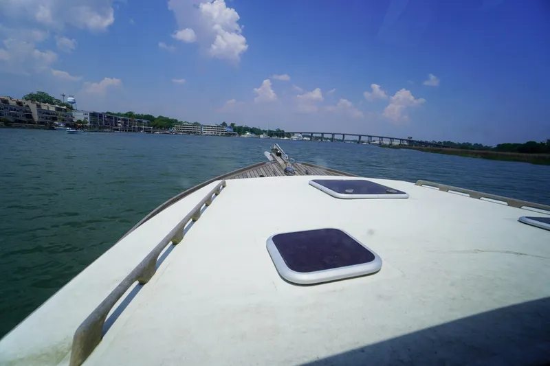 Slide: The Image of Bow view of 2001 Redfern Mitchell Cove 32 boat on a sunny day. - 31