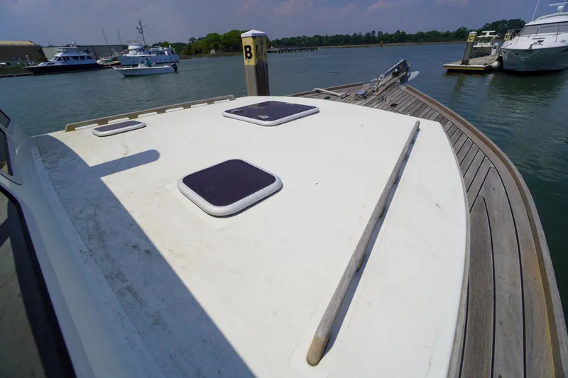 Slide: The Image of Bow view of 2001 Redfern Mitchell Cove 32 docked at marina. - 36