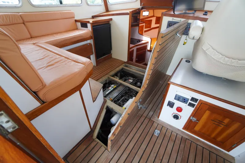 Slide: The Image of Interior of 2001 Redfern Mitchell Cove 32 boat with open engine compartment. - 38
