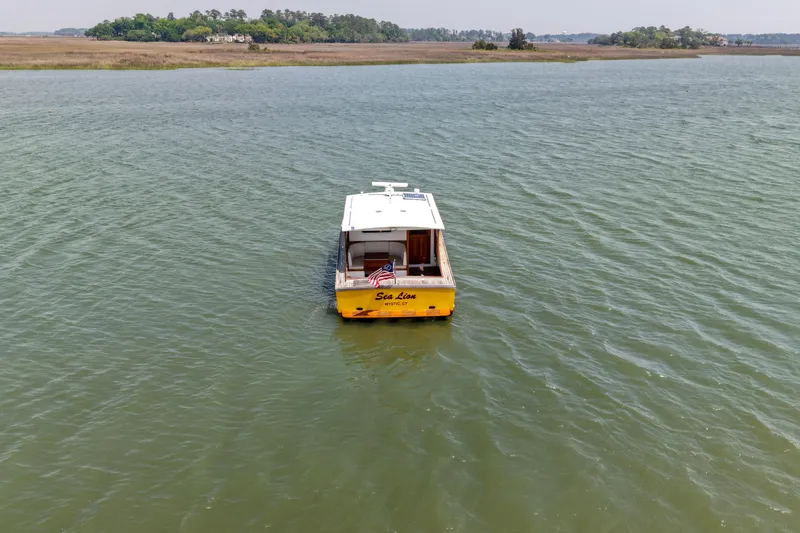 Slide: The Image of A 2001 Redfern Mitchell Cove 32 boat named "Sea Lion" on calm waters. - 6