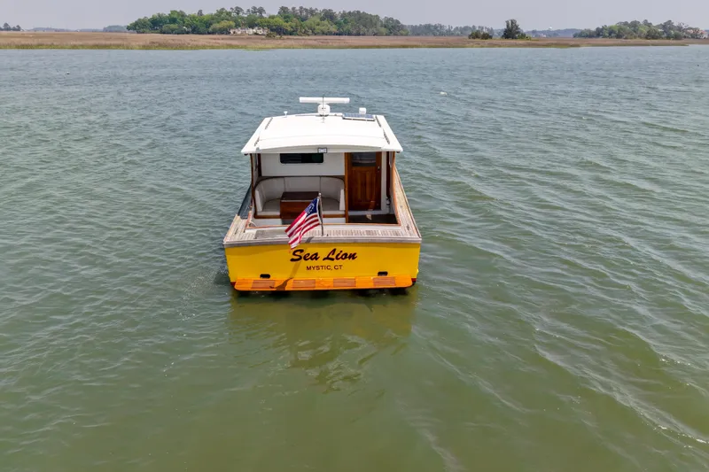 Slide: The Image of Yellow Redfern Mitchell Cove 32 boat named "Sea Lion" on water, Mystic, CT, 2001 model. - 7