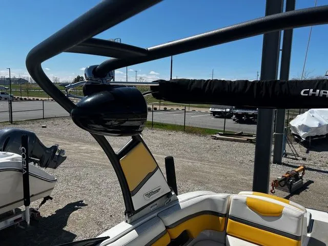 Slide: The Image of 2015 Chaparral Vortex 223 VRX boat with yellow seats and black wakeboard tower. - 11