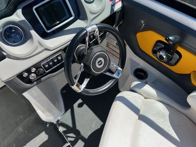 Slide: The Image of Interior of a 2015 Chaparral Vortex 223 VRX boat with steering wheel and dashboard. - 13