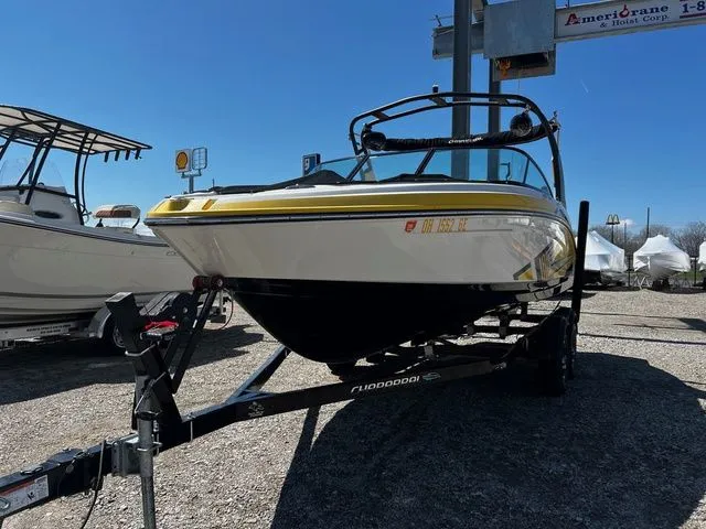Slide: The Image of 2015 Chaparral Vortex 223 VRX boat on trailer outdoors. - 3