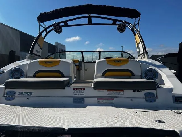 Slide: The Image of Rear view of 2015 Chaparral Vortex 223 VRX boat with yellow seats. - 6