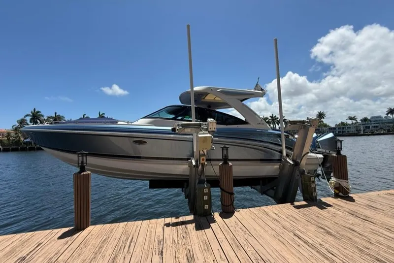 The Image of 2025 Formula 330 Crossover Bowrider OB on dock, sunny waterfront view. - 0
