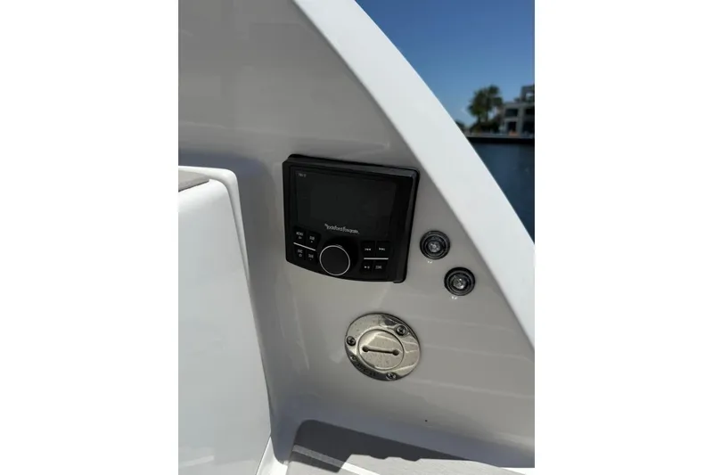 Slide: The Image of 2025 Formula 330 Crossover Bowrider OB dashboard with control panel and switches. - 12