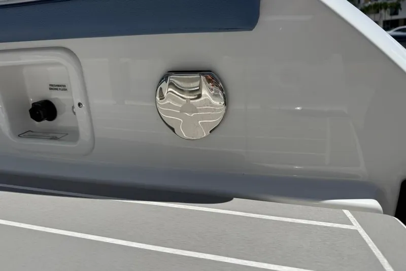 Slide: The Image of Close-up of 2025 Formula 330 Crossover Bowrider OB boat's freshwater engine flush feature. - 13
