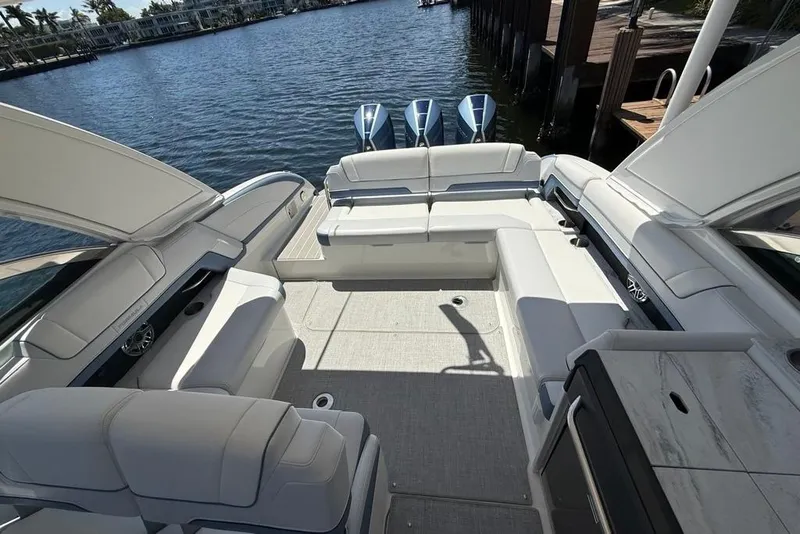 Slide: The Image of 2025 Formula 330 Crossover Bowrider OB with spacious seating and triple outboard engines. - 18