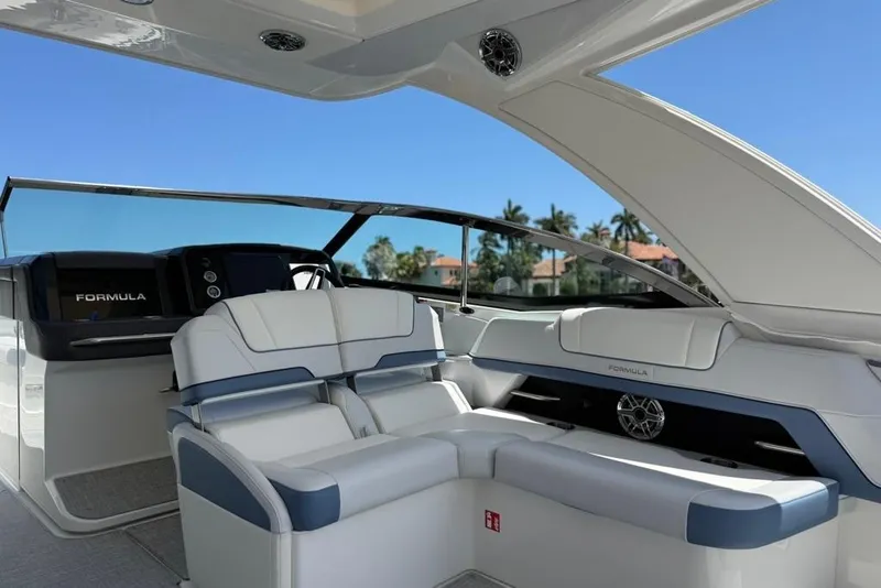 Slide: The Image of 2025 Formula 330 Crossover Bowrider OB interior with luxurious seating and modern design. - 21