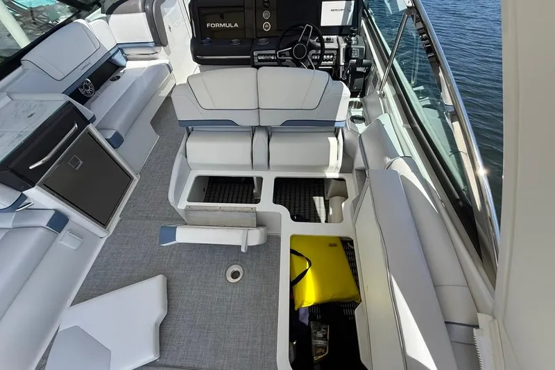 Slide: The Image of 2025 Formula 330 Crossover Bowrider OB interior with seating and storage compartments. - 22