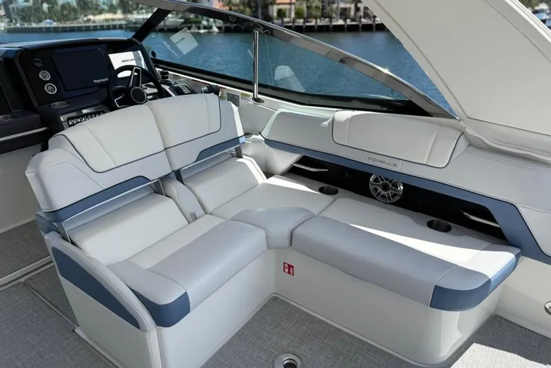 Slide: The Image of 2025 Formula 330 Crossover Bowrider OB interior with seating and storage compartments. - 24