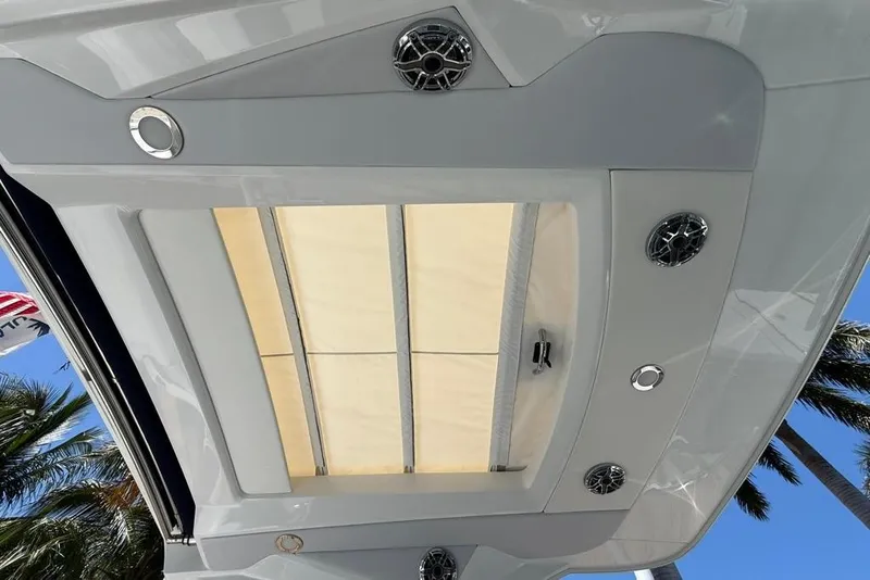 Slide: The Image of 2025 Formula 330 Crossover Bowrider OB interior seating with speaker detail. - 29