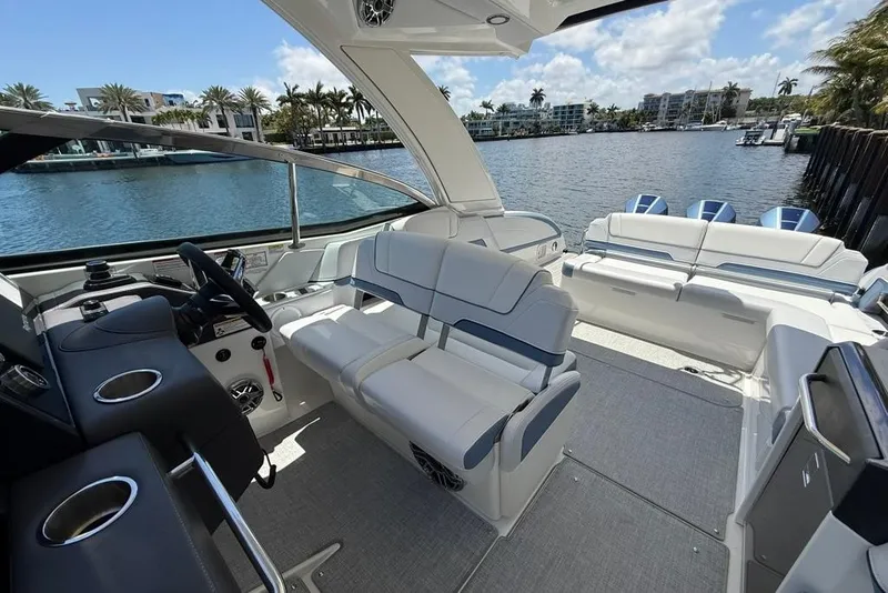 Slide: The Image of 2025 Formula 330 Crossover Bowrider OB boat roof with speakers and sunroof. - 31