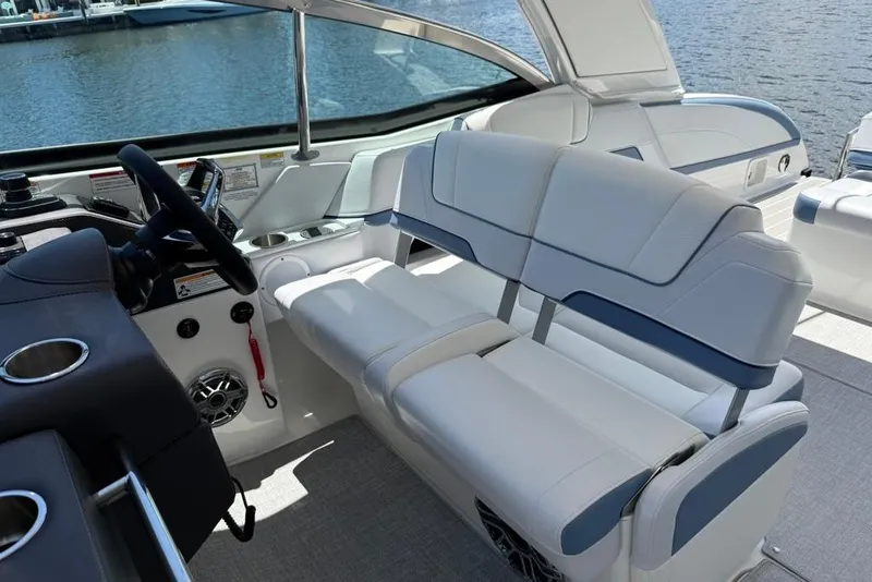 Slide: The Image of 2025 Formula 330 Crossover Bowrider OB on a sunny waterfront, showcasing luxury design. - 32