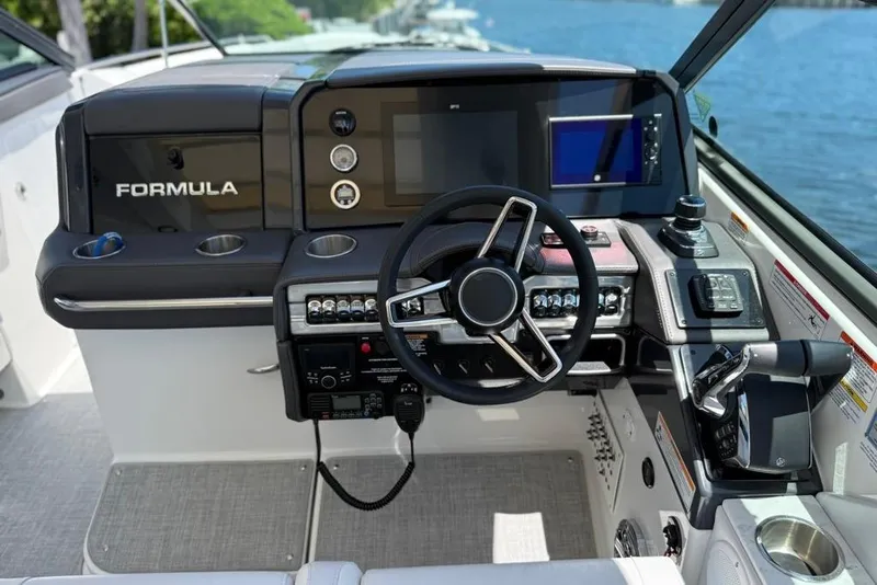 Slide: The Image of 2025 Formula 330 Crossover Bowrider OB interior with luxurious seating and waterfront view. - 33