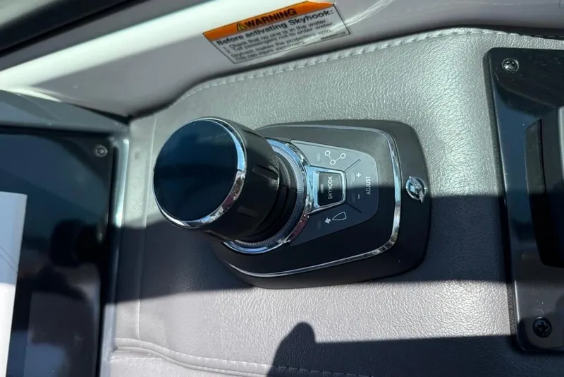 Slide: The Image of Joystick control panel on 2025 Formula 330 Crossover Bowrider OB boat dashboard. - 36