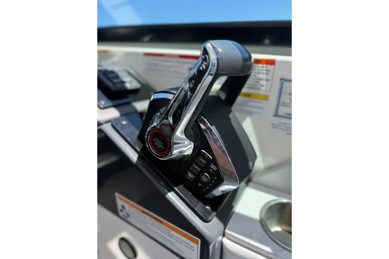 Slide: The Image of Control panel of 2025 Formula 330 Crossover Bowrider OB with radio and warning labels. - 37