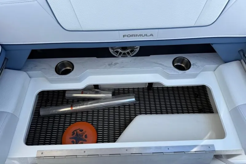 Slide: The Image of 2025 Formula 330 Crossover Bowrider OB interior with gray flooring and seating. - 42