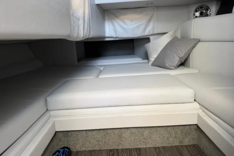 Slide: The Image of 2025 Formula 330 Crossover Bowrider OB cabin interior with plush seating and cushions. - 48
