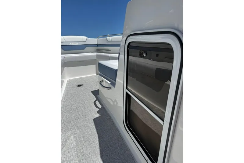 Slide: The Image of 2025 Formula 330 Crossover Bowrider OB interior storage compartment open. - 57
